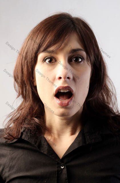 A woman with her mouth open and looking surprised.