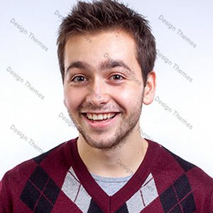 A man with brown hair and a red sweater.