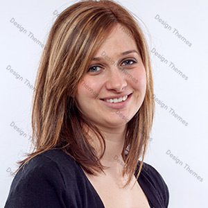 A woman with long hair and brown eyes.