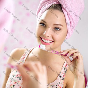 A woman is brushing her teeth with pink toothbrushes.