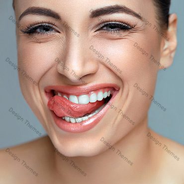 A woman with white teeth smiling for the camera.