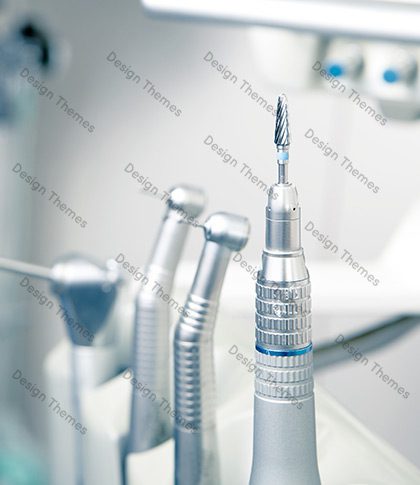 A close up of some dental instruments on a table