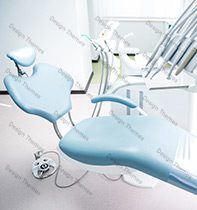 A dentist chair and other equipment in an office.