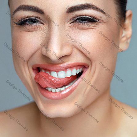 A woman with red lipstick smiling for the camera.