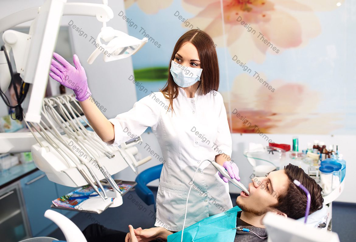 A dentist and his assistant in the dental chair.
