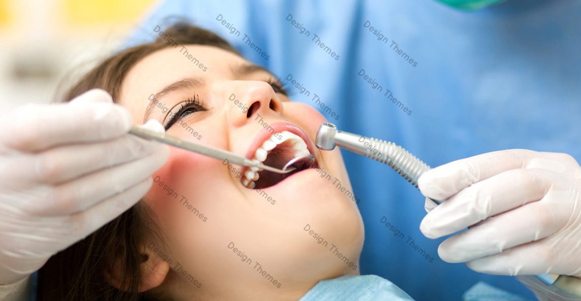 A woman is getting her teeth cleaned by dentist.