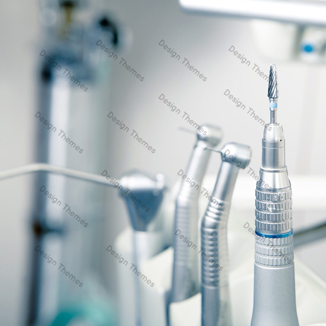 A close up of some dental instruments on the counter