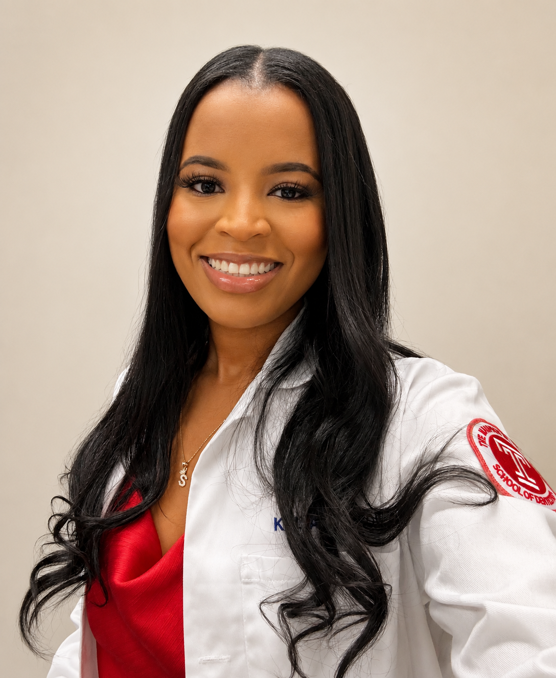 Smiling female doctor in white lab coat